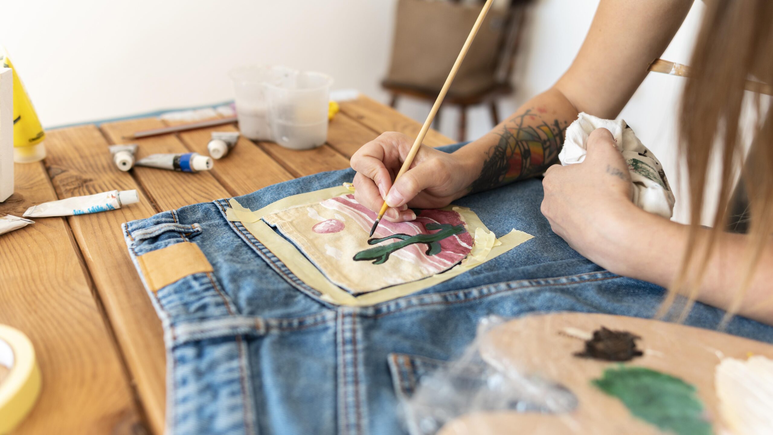 close-up-hand-painting-with-brush